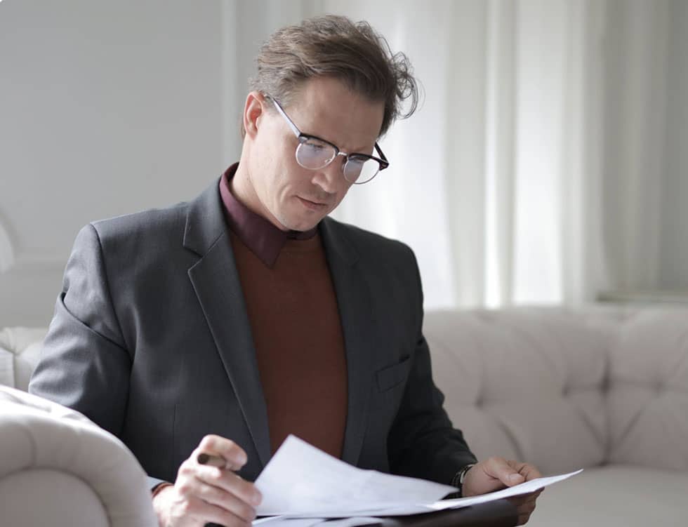 Man Reading Papers